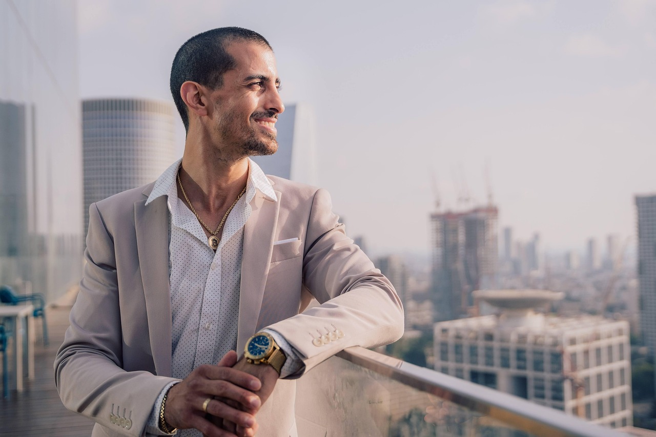 Solo founder looking over city skyline, reflecting on business growth, discipline, and future exit potential.