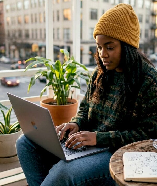 Solopreneur working on laptop in home office
