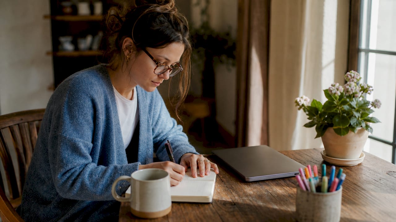 Solo entrepreneur working at home office desk