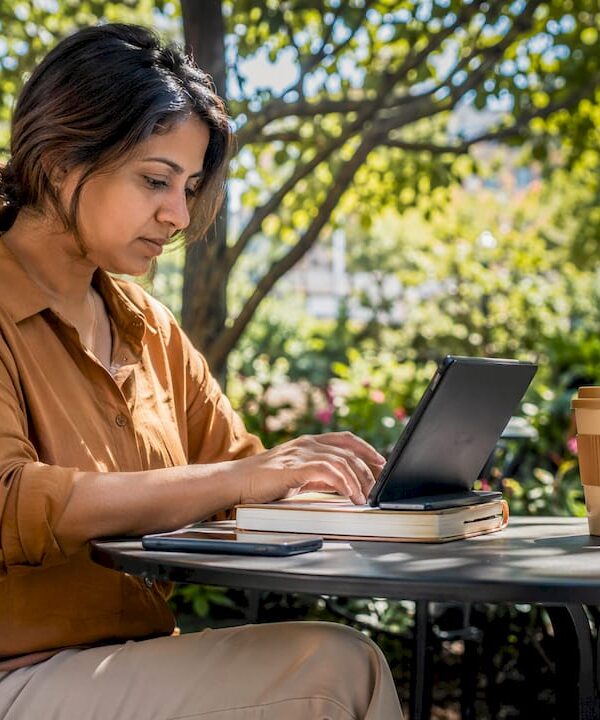 Solopreneur working on AI workflows at home desk