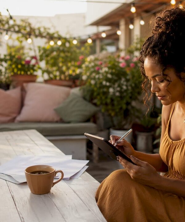 Woman drafting solopreneur business plan in loft