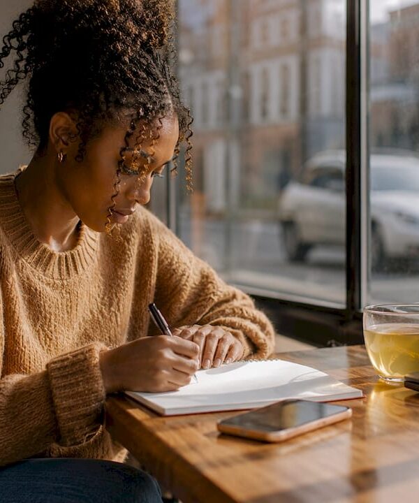 Black woman working on laptop at home