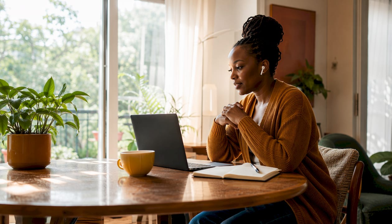 Solopreneur in virtual community call at kitchen table