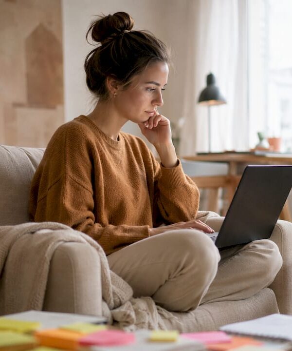 Exhausted solopreneur at home office desk
