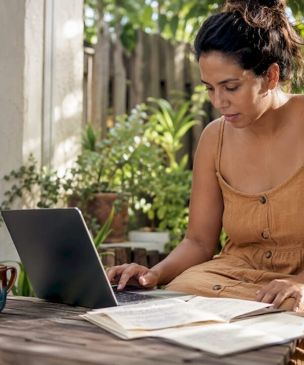 Content creator using AI writing tools at desk