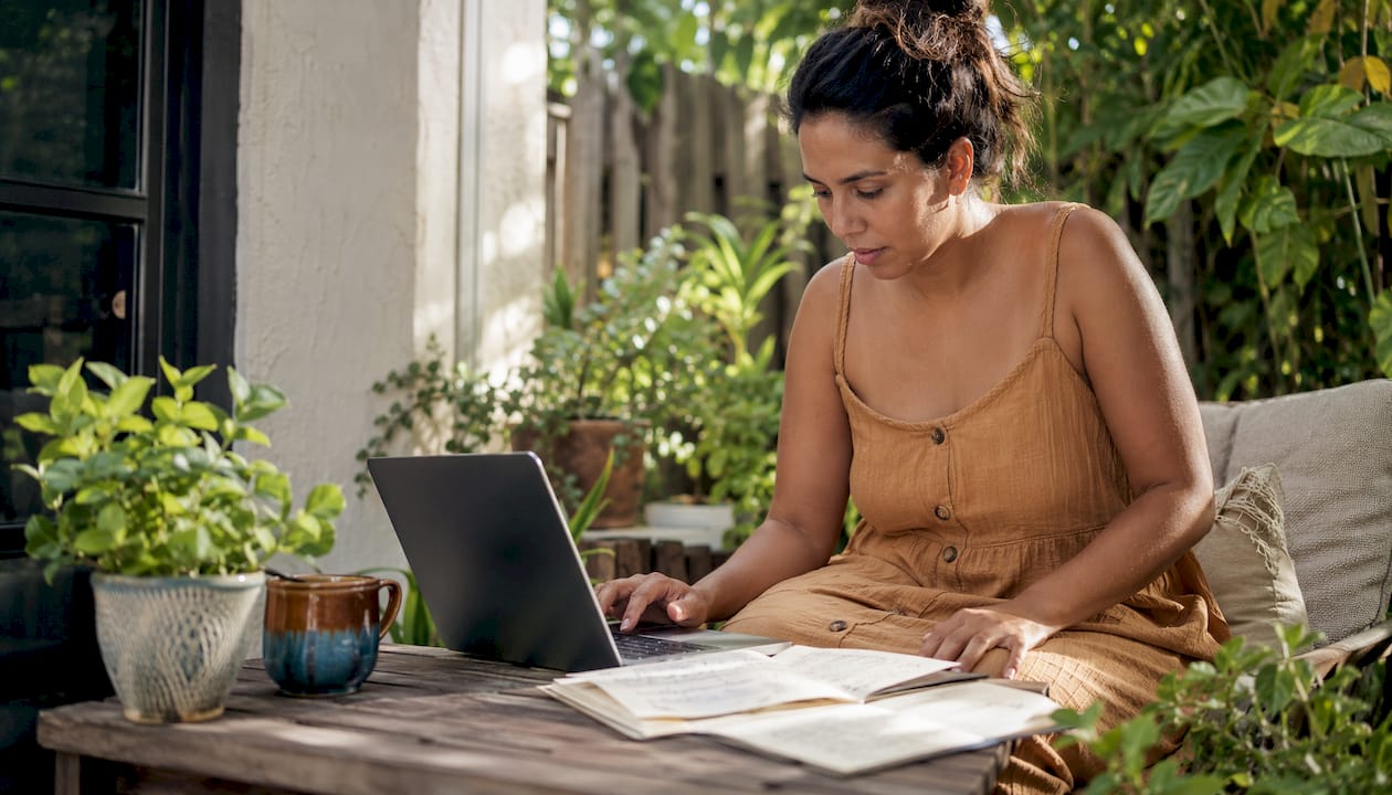 Content creator using AI writing tools at desk